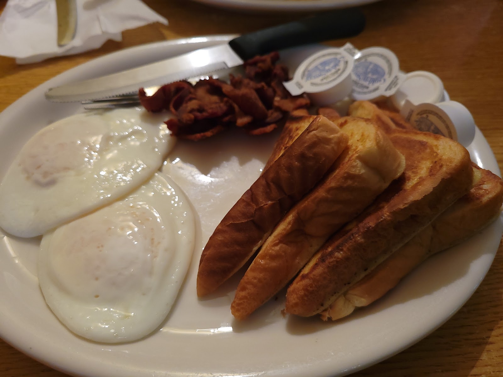 Fried eggs with bacon and toast