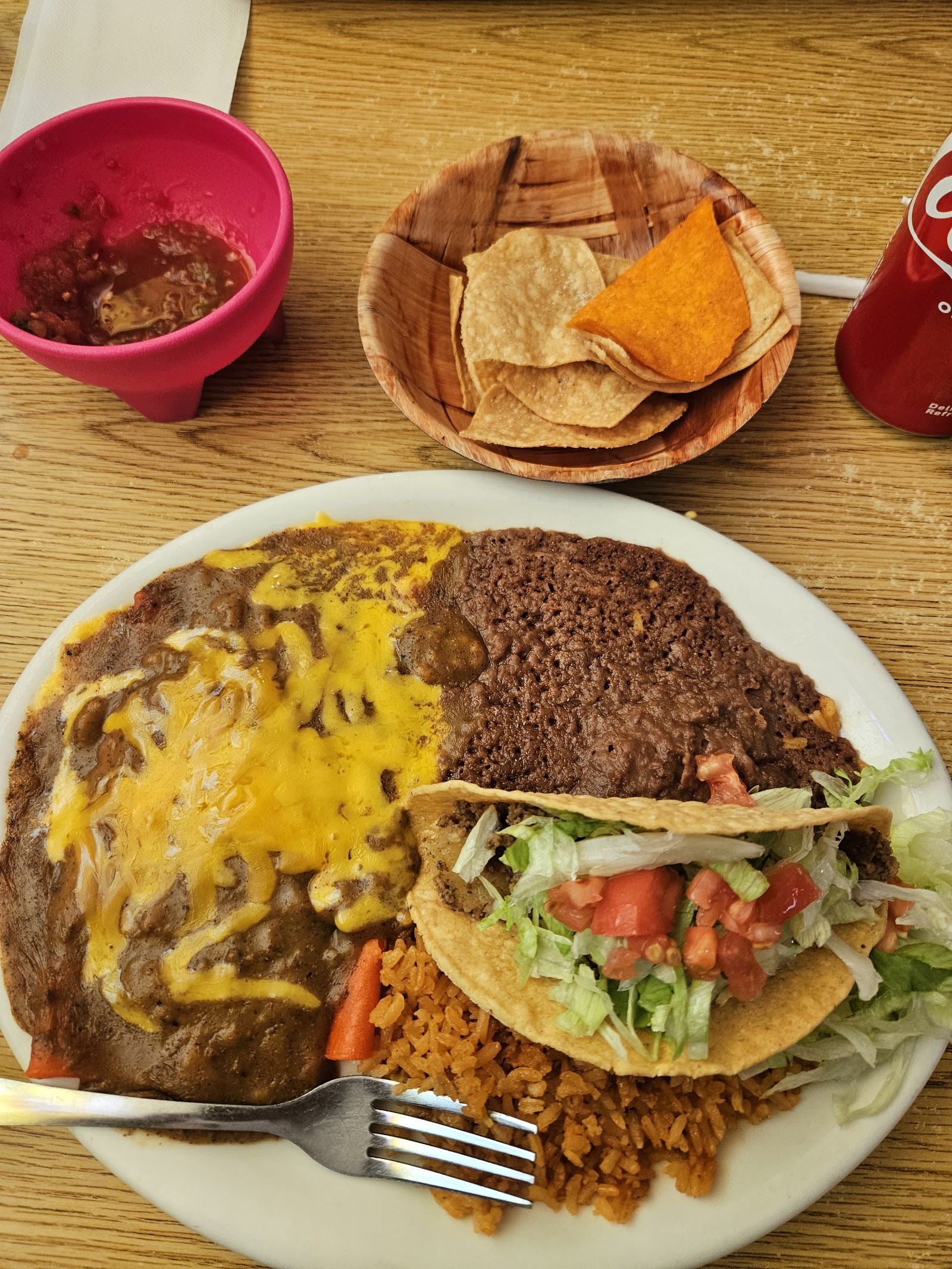Cheese enchilada plate with taco, rice, beans and chips