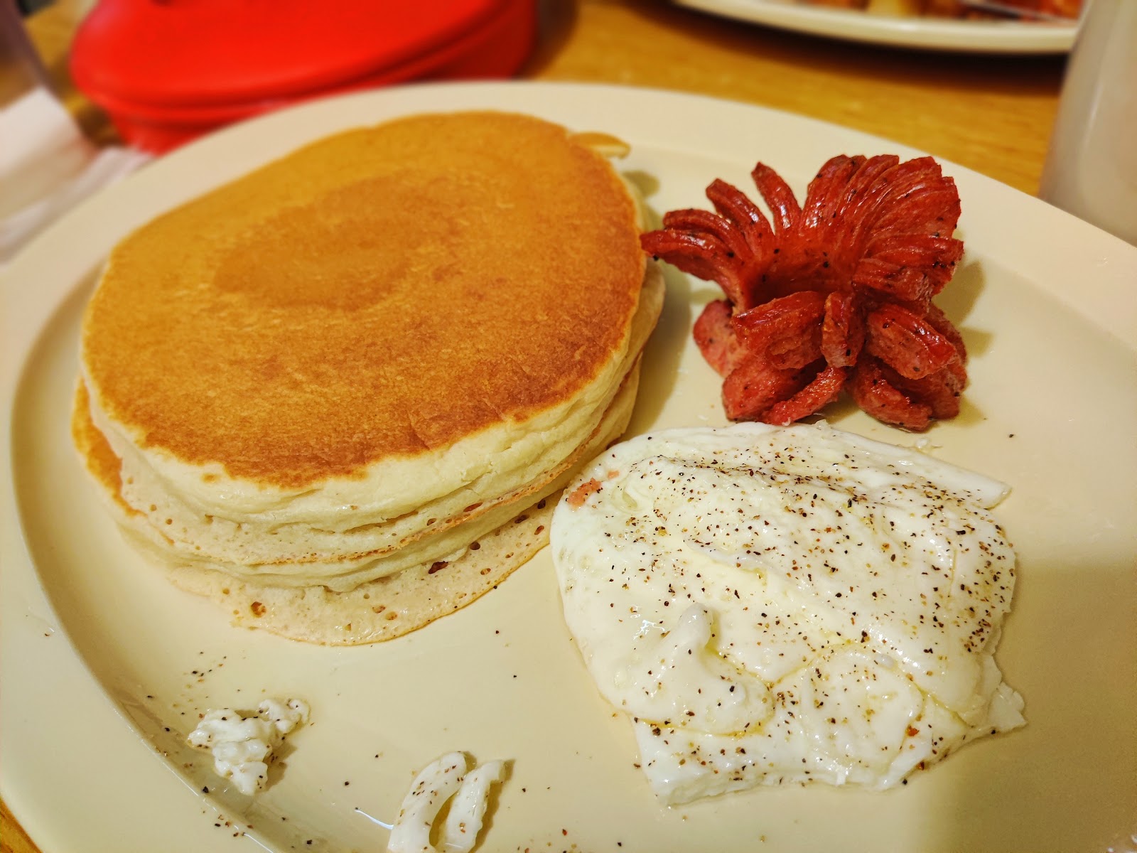 Pancakes with sausage and a fried egg